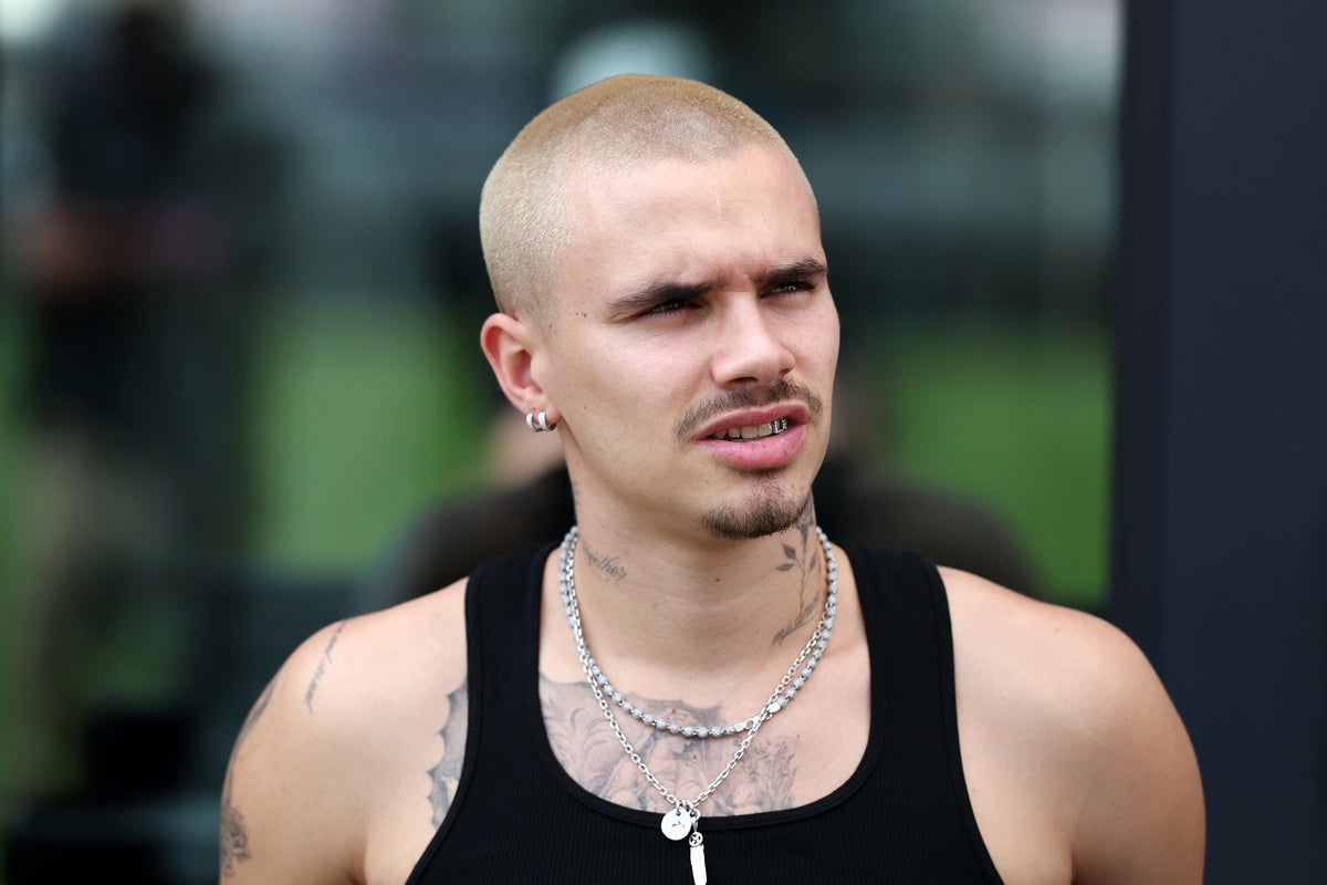 Image for the article: Romeo Beckham picks his side in family feud with bold new tattoo