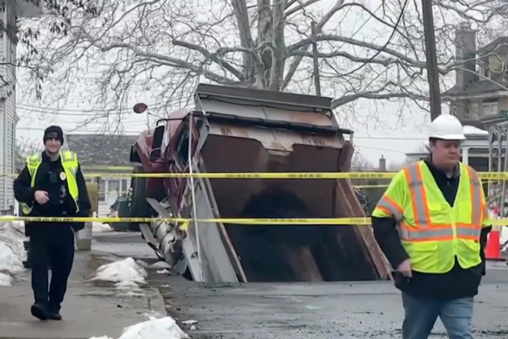 Image for the article: A dump truck trying to help with a sinkhole in New Jersey swallowed up by another sinkhole: ‘Honestly, I am still in shock’