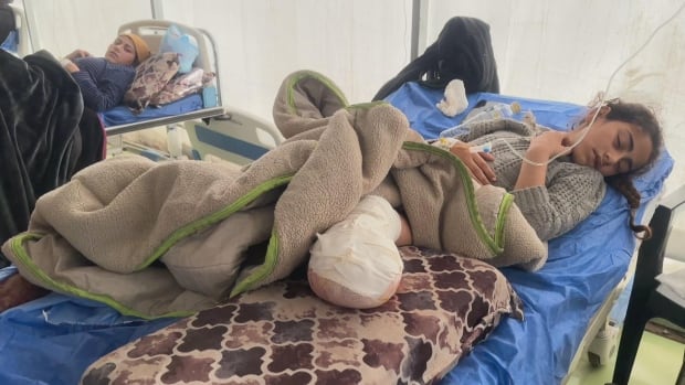 Image for the article: 'We could barely walk,' sisters say after being ordered to evacuate northern Gaza's last major hospital