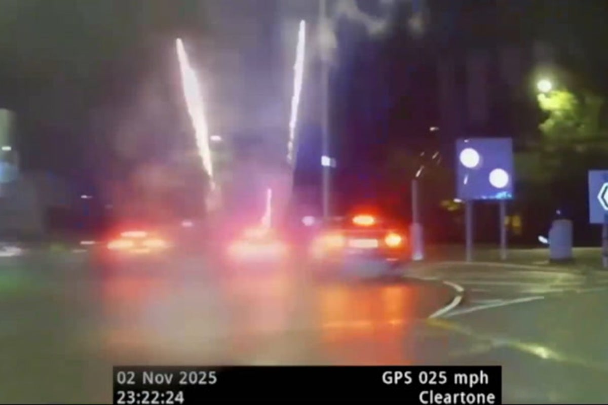 Image for the article: Moment driver launches fireworks from car window during police chase down busy road
