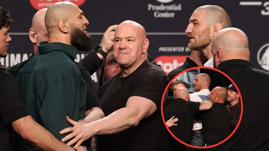 文章配图： 卡马赞·奇马耶夫在 UFC 328 新闻发布会上向肖恩·斯特里克兰发起踢击，引发大规模混战